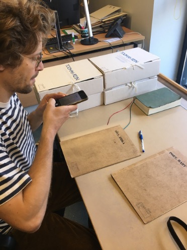 Gregor Taul examines Erika Nõva's personal file in the archives of the Estonian Museum of Architecture. Tallinn, 2024 Photo credits: Merilin Tee